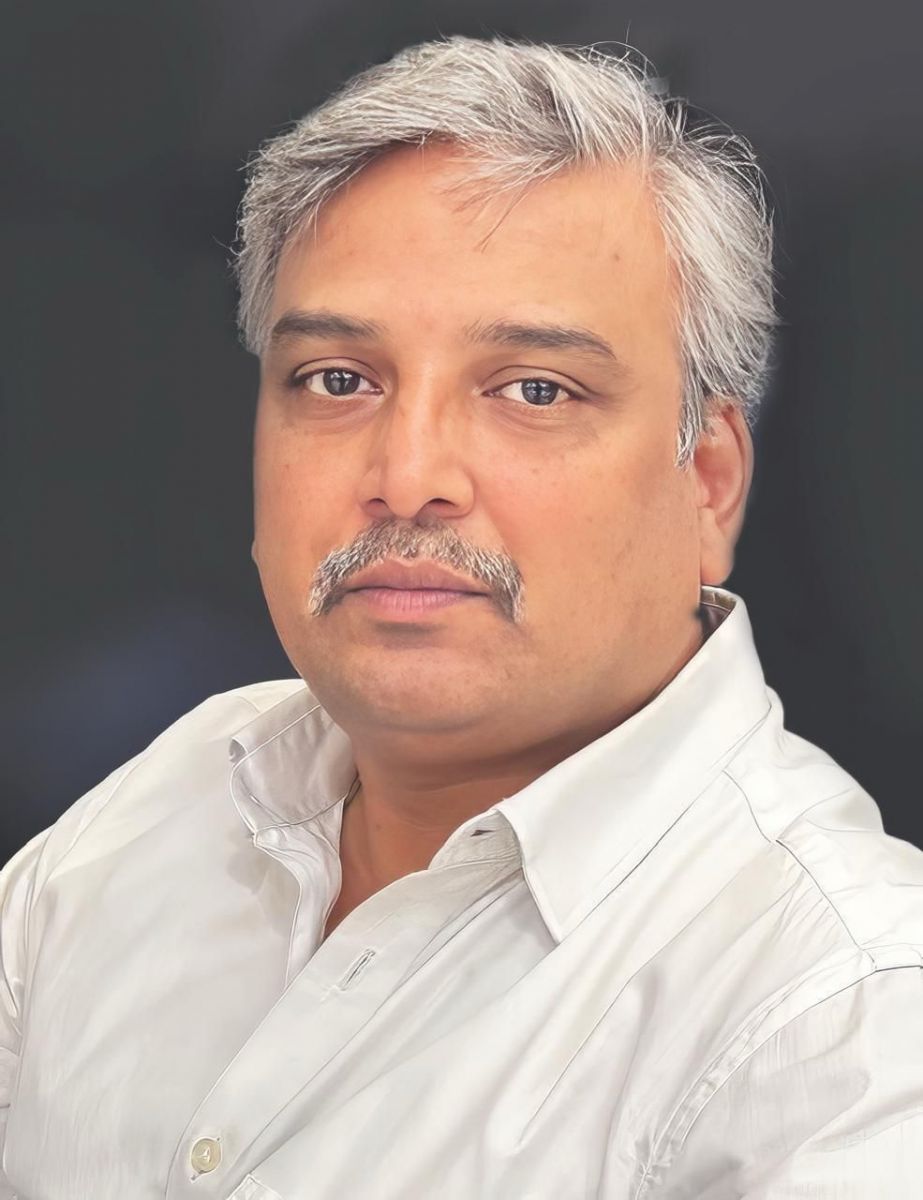 Dr. Purushotham B